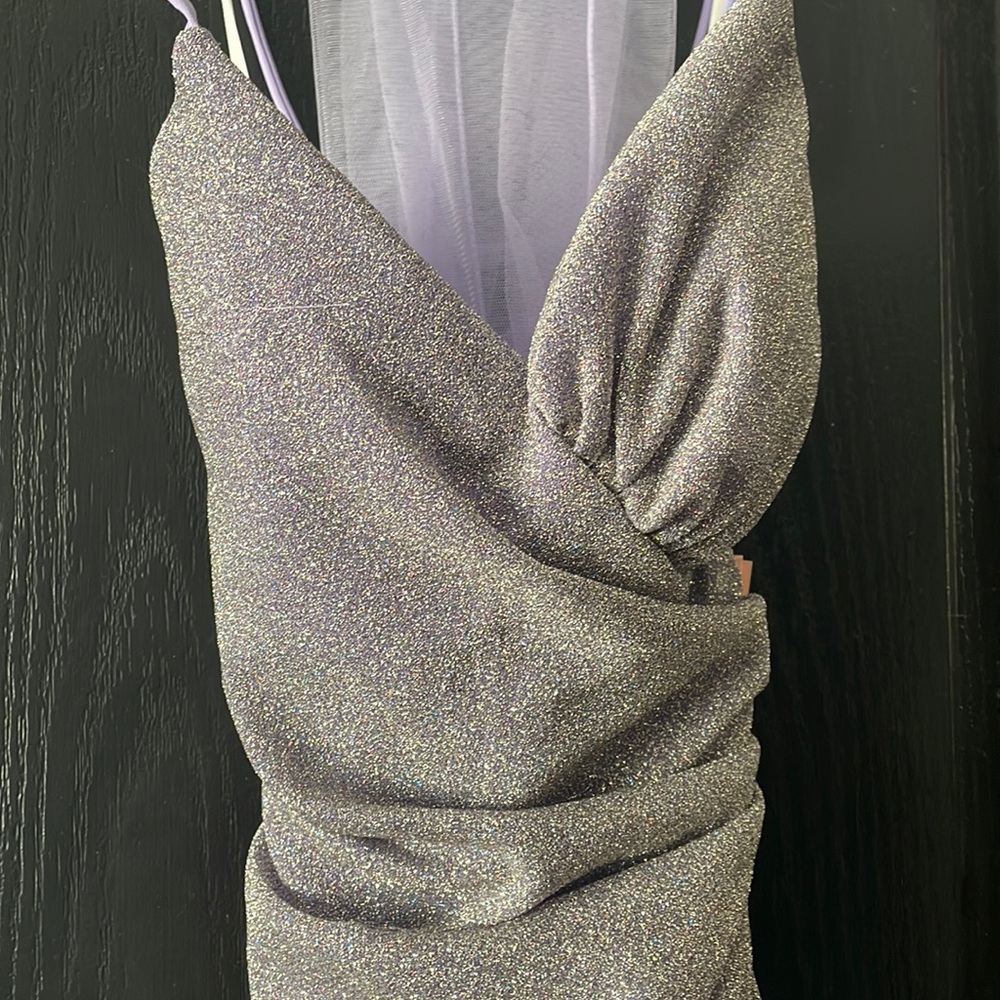 Selling a brand new lilac sparkly dress. Never worn.